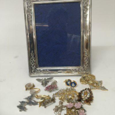 A modern silver picture frame and a quantity of dress jewellery.