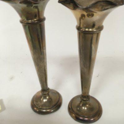 Two silver trumpet shaped vases with shaped edges maker Walker Hall Sheffield hallmarks loaded bases good condition maximum height 25cm