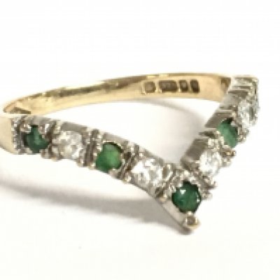 A 9 carat yellow gold wishbone emerald and diamond set ring, 1.7g. Size P. Postage category a