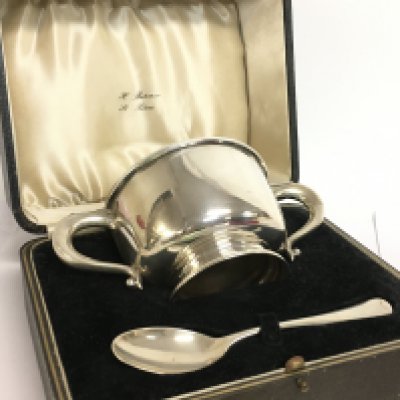 A cased silver hallmarked cup and spoon