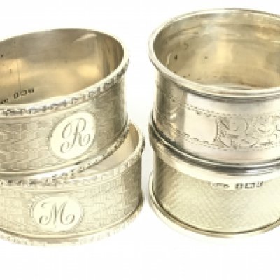 Four silver hallmarked napkin rings. Postage category A