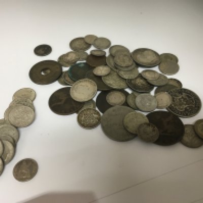 A collection of coins including a Victorian 1838 silver four pence with good definition a collection of George VI pre 1946 three pence possible uncirculated very good definition and a quantity of other mixed coins.