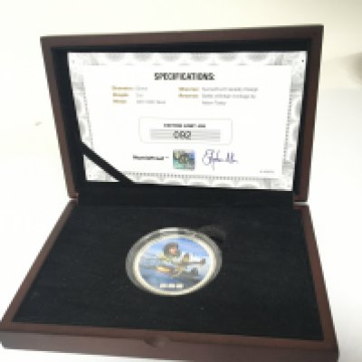 A Silver two ounce limited edition Battle of Britain coin 92/495 in a fitted box with certificate of Authenticity.
