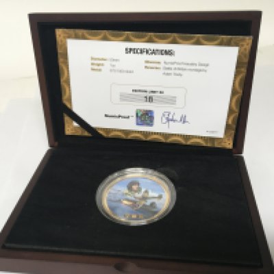 A 9carat gold one ounce Battle of Britain enamel decorated coin 18/50 with certificate of Authenticity in a fitted box.