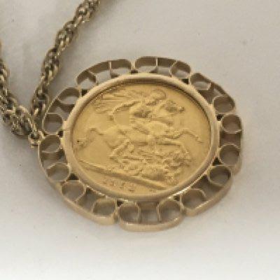 An Elizabeth II 1958 Sovereign set in 9carat gold mount with attached gold rope chain total weight 26g