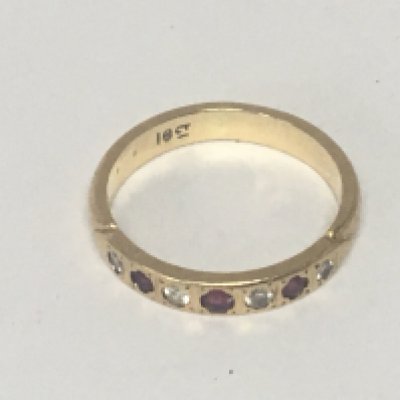 An 18carat gold ring set with alternating ruby and diamonds weight 3.5g ring size M-N