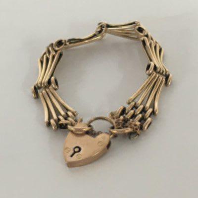 A 9carat gold gate bracelet with a padlock clasp.weight 10g