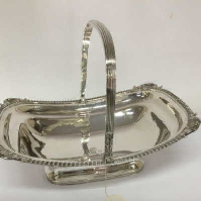 A fine George III silver basket with a swivel handle London hallmarks for 1809 maker Rebecca Earnes and Edw Barnard the solid basket with a Gadroon edge weight 1018g (over one kg.)