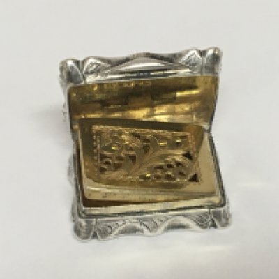 A silver and parcel gilt Vinaigrette with a hinged top and gilt interior Birmingham 1851 hallmarks maker Hilliard & Thomson.