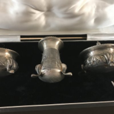 A Colonial silver condiment set marked sterling in a fitted box