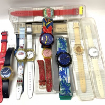 A collection of Modern and vintage Swatch wristwatches. (B)