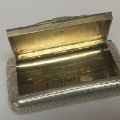 A Quality George III silver snuff box parcel gilt decoration with a patterned surface London 1808 hallmarks. 6.5cm long. nice condition.