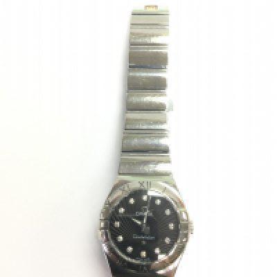 An Omega Constellation watch with a diamond set dial. Comes with warranty card. Shipping category B.