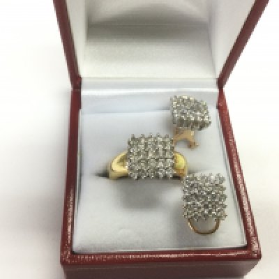 An 18ct gold diamond ring set with 25 diamonds plus a matching pair of earrings, approx 11.3g. Shipping category A.