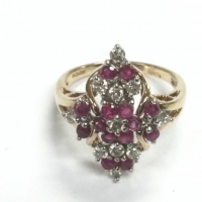 A 9ct gold diamond and ruby cluster ring, approx 3.9g. Shipping category A.