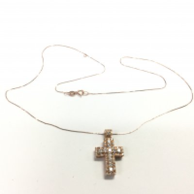 An 18ct rose gold diamond set cross pendant on an 18ct rose gold chain, approx 3.6g. Shipping category A.