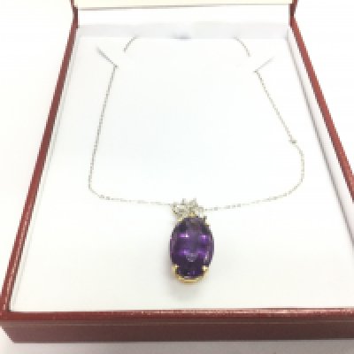 An 18ct gold, amethyst and diamond pendant, approx 7.9g. Shipping category A.