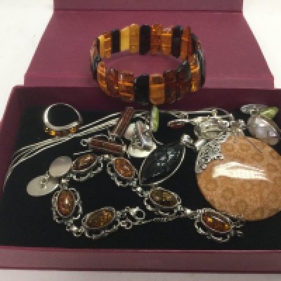 A collection of silver and amber jewellery. Shipping category A.