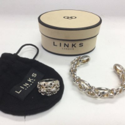 A Links of London bangle and a ring (2). Shipping category B.