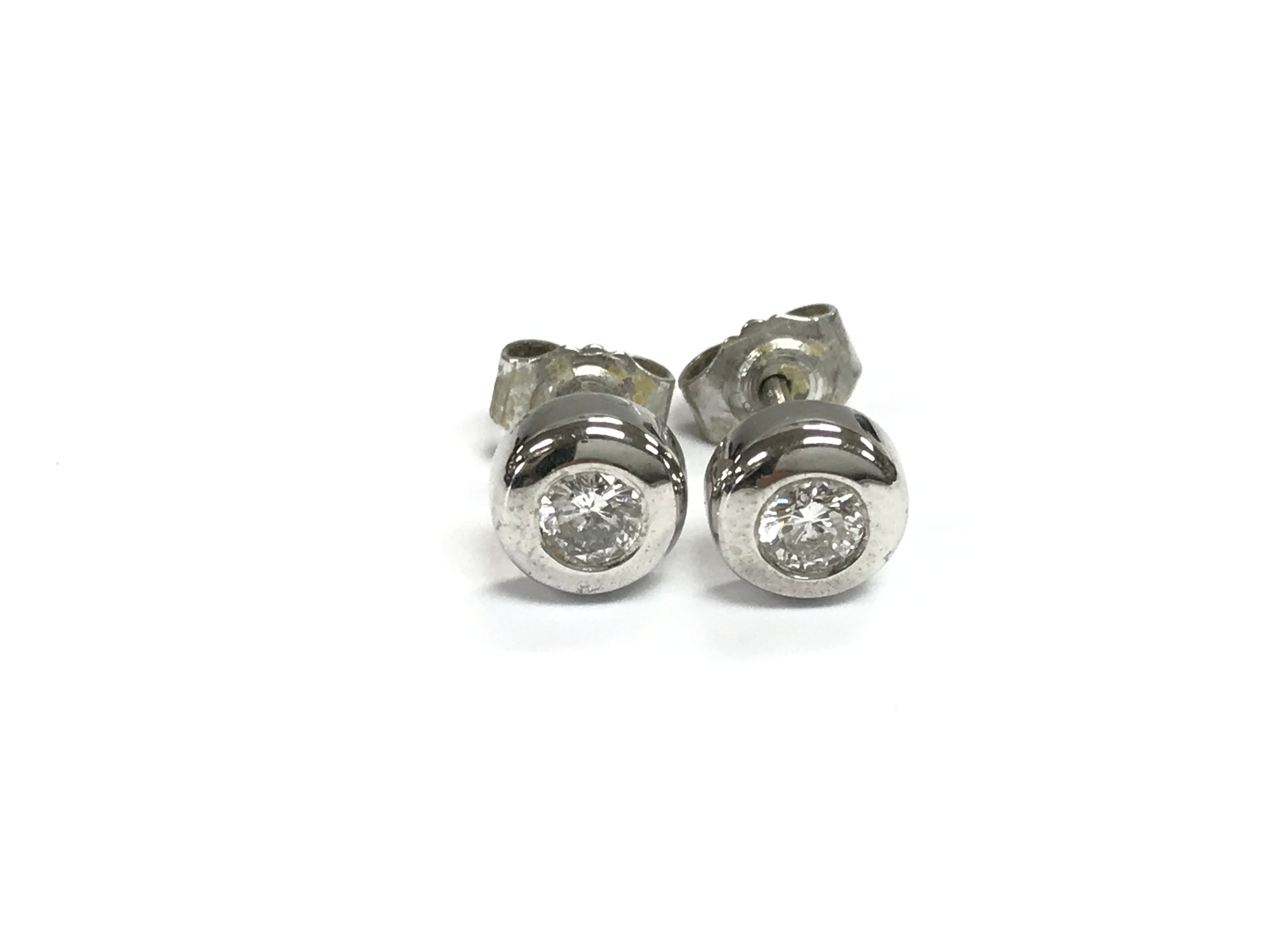 A pair of 18ct white gold diamond stud earrings. 2.61g