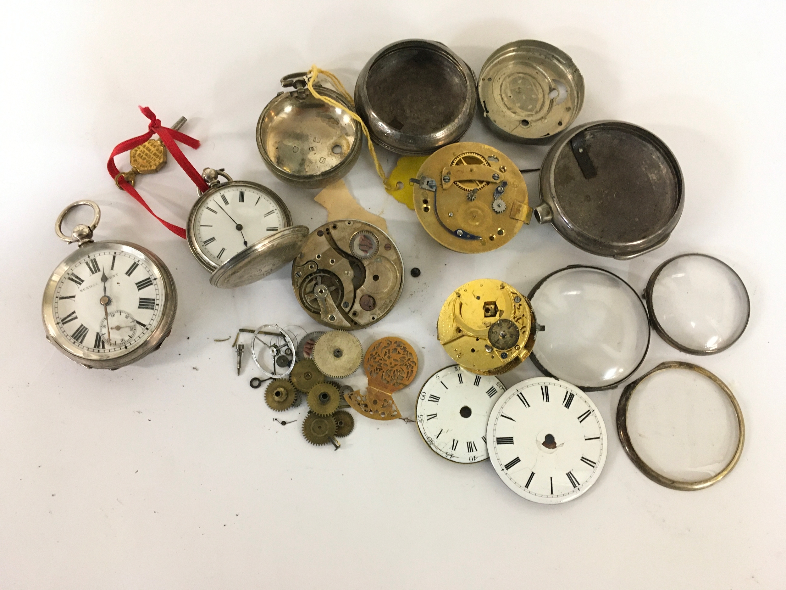 A 19th century silver verge watch, another by Kendal & Dent, stamped 800, plus assorted silver cases and parts 87g