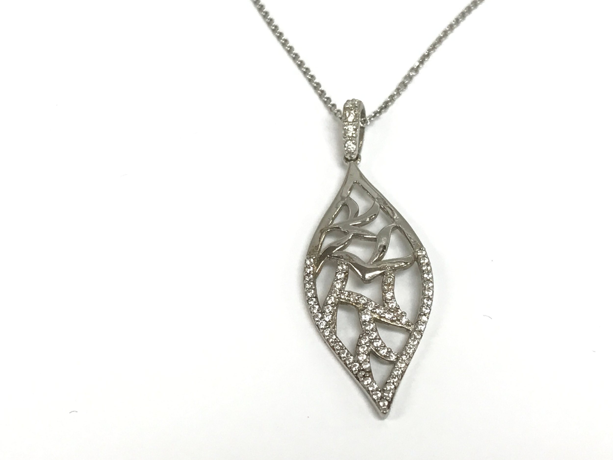 Leaf shaped pendant set with CZ on a silver chain.