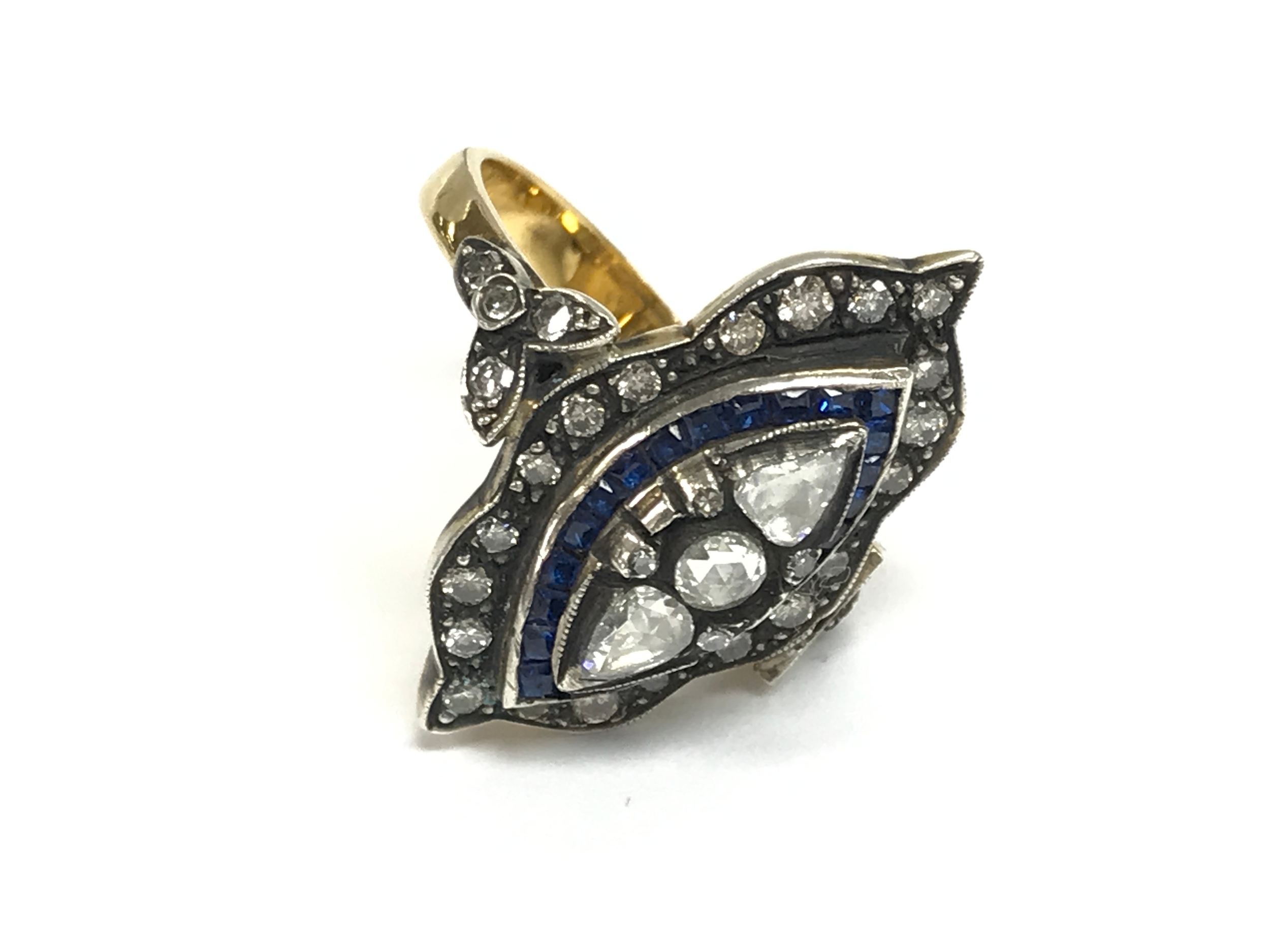 8ct yellow gold nouvette style dress ring set with square synthetic sapphires pear shaped rose cut diamonds round rose cut diamonds and round cut diamonds. Sapphires approx 0.45ct and diamonds 0.65ct approx. Size O 1/2 approx.