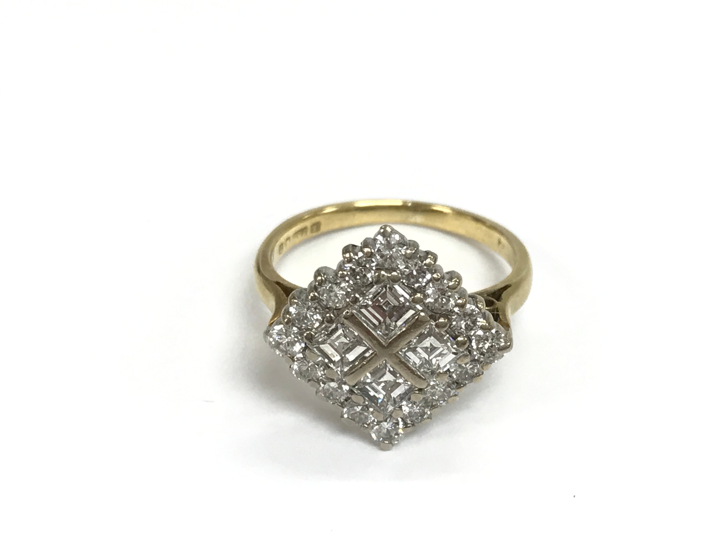 An 18ct white and yellow gold square ring set with princess cut and round cut diamonds. Approx 1ct. Size L