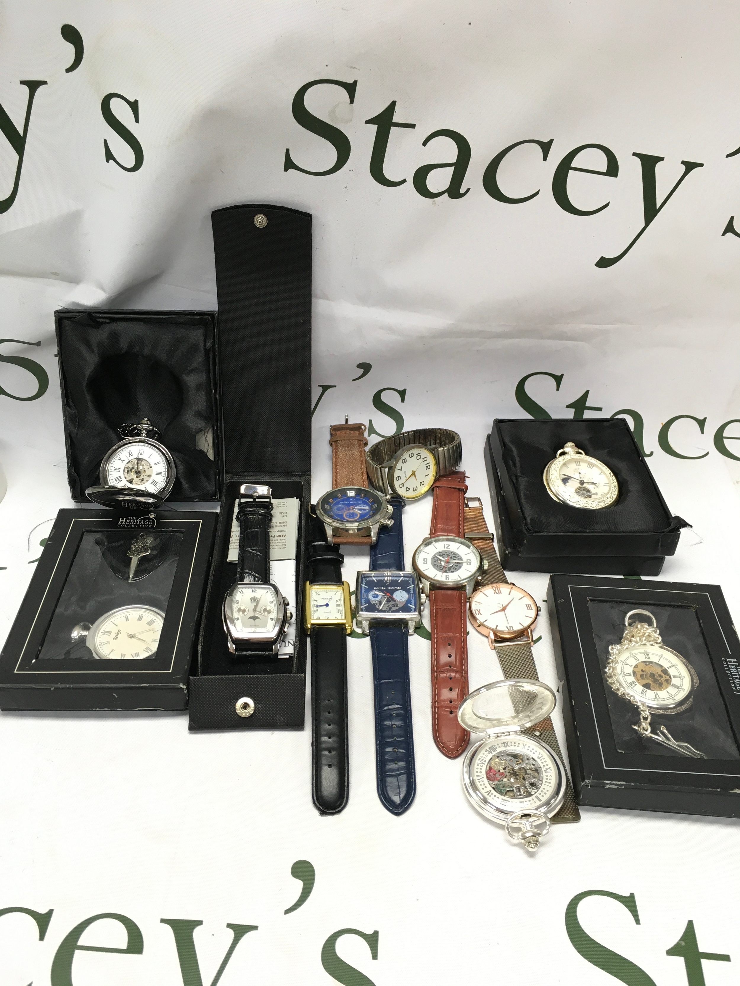 A collection of 7 dress watches and 5 reproduction pocket watches.