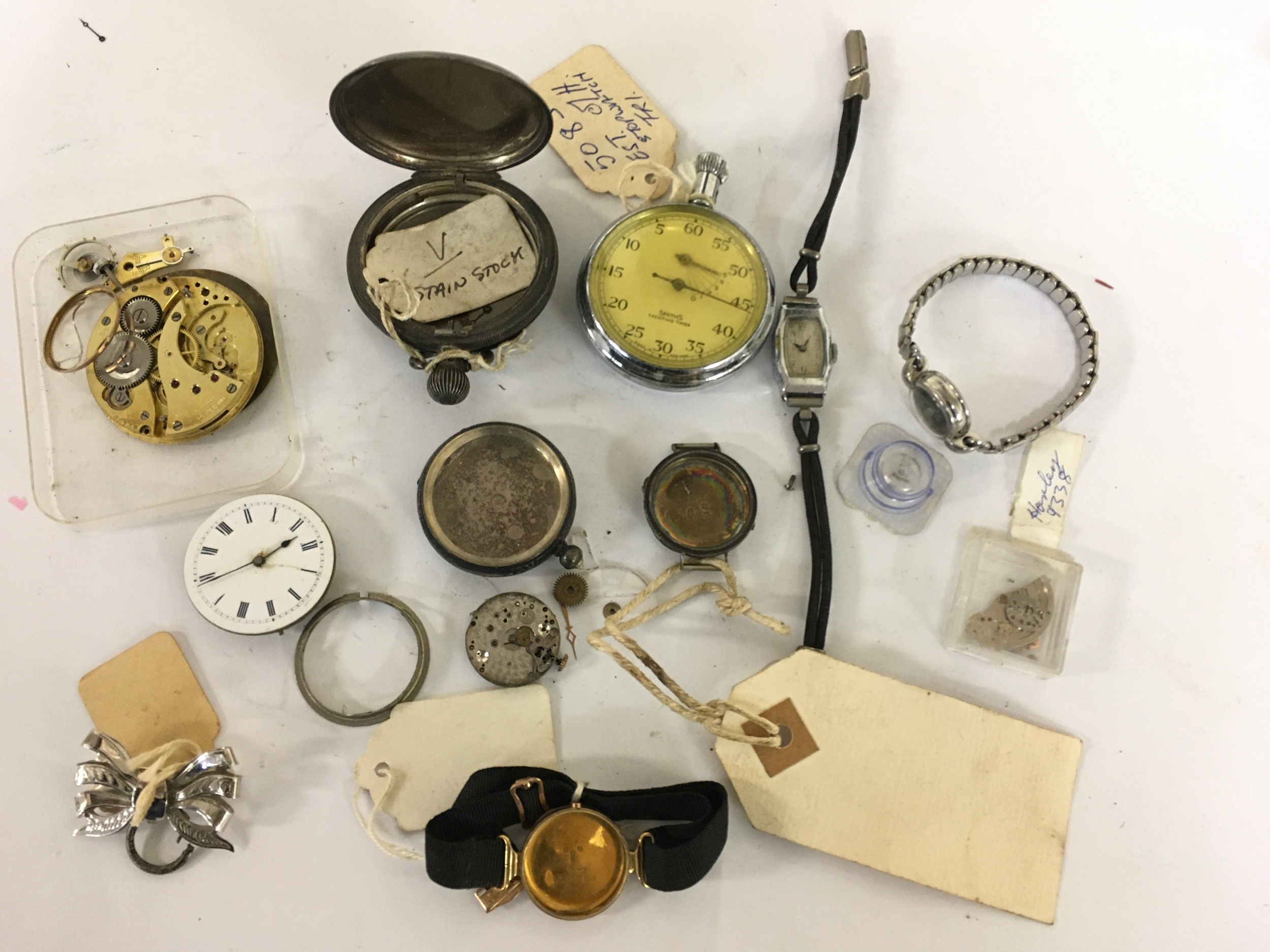 A 9ct yellow and rose gold watch back, plus silver and white metal pocket watch cases and parts 6.2g gold
