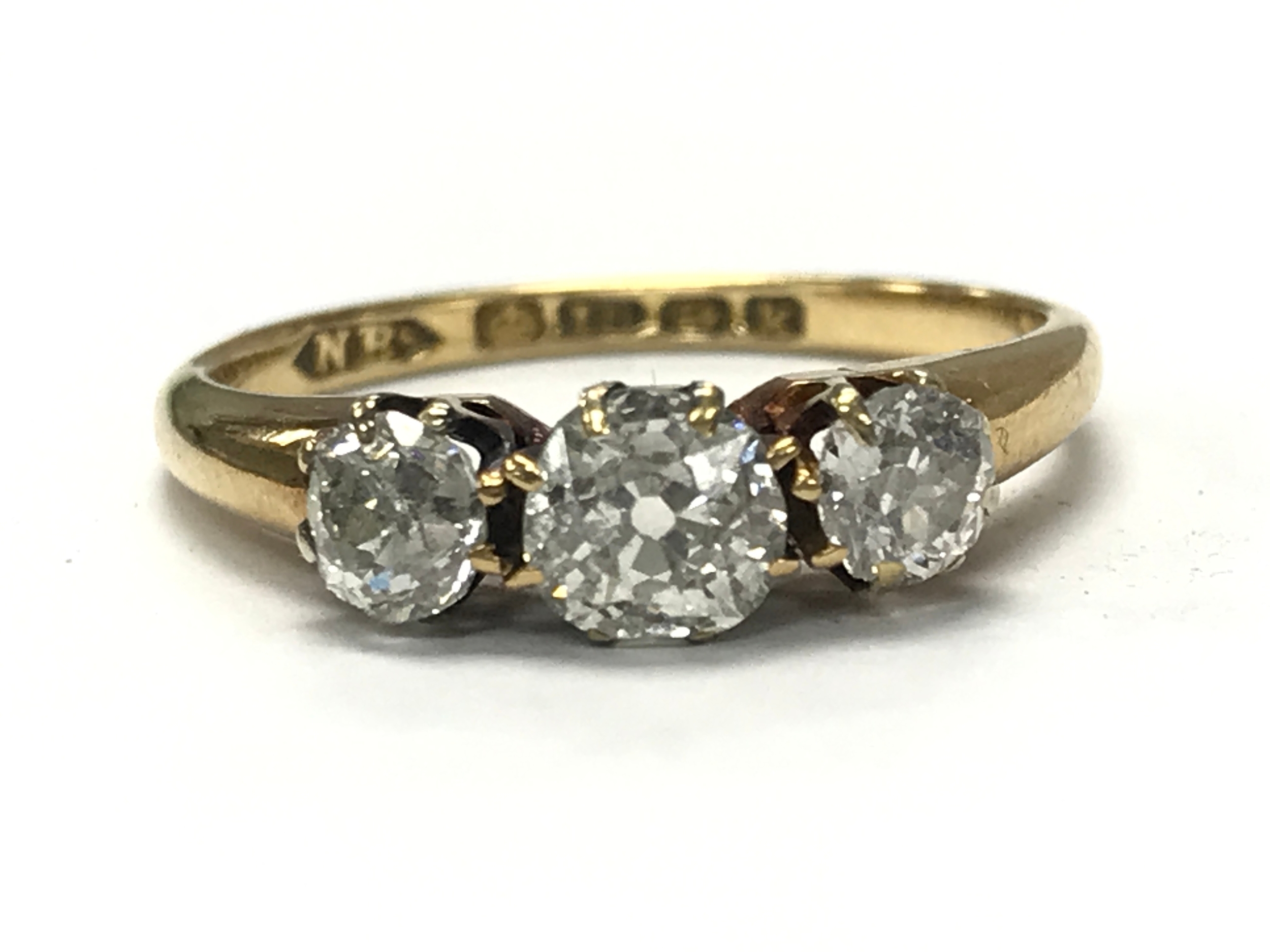 An 18ct gold diamond trilogy ring, 2.8g total weight size L/K