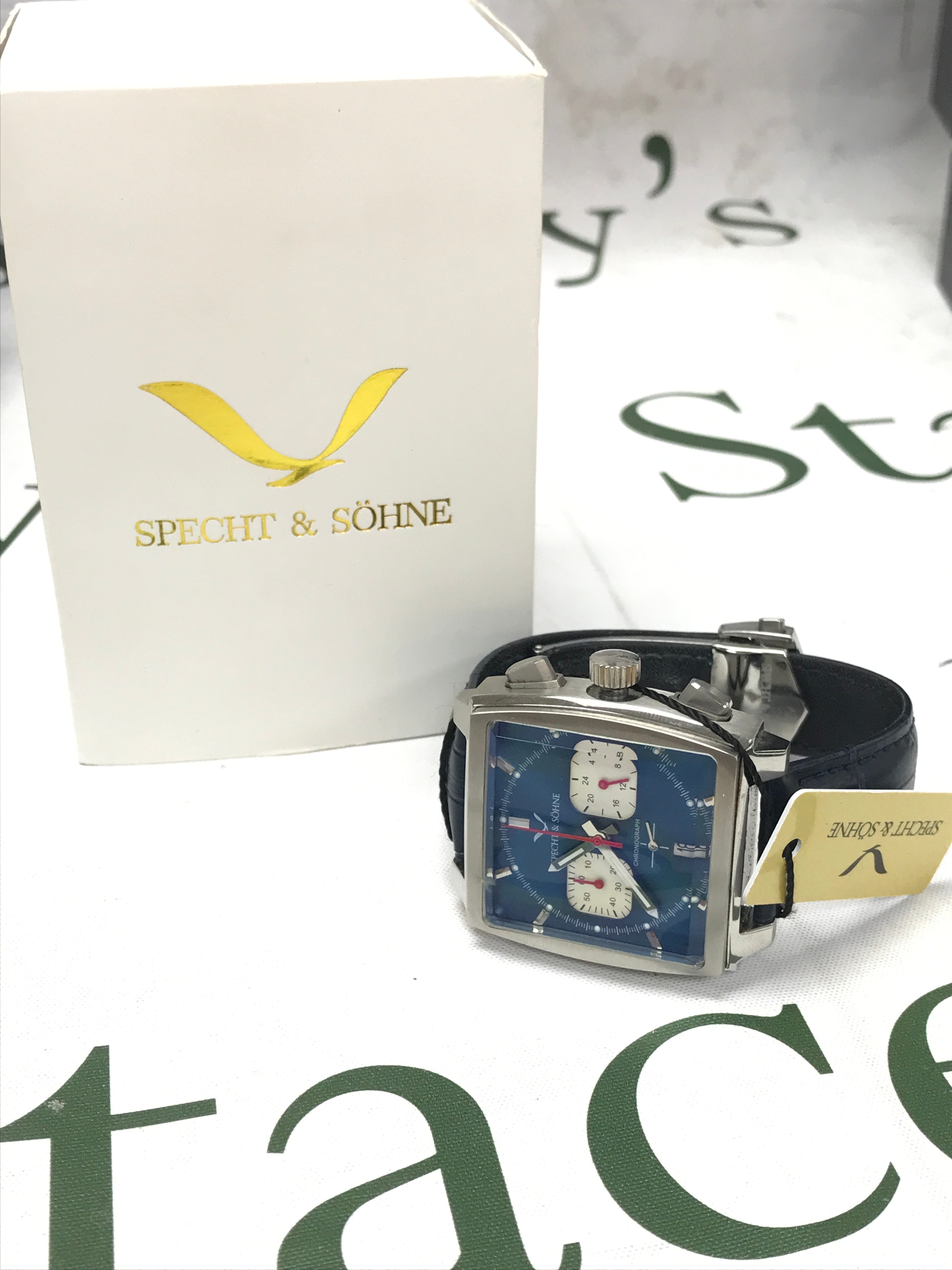 A boxed Specht & Söhne Monaco homage chronograph watch, seen working 