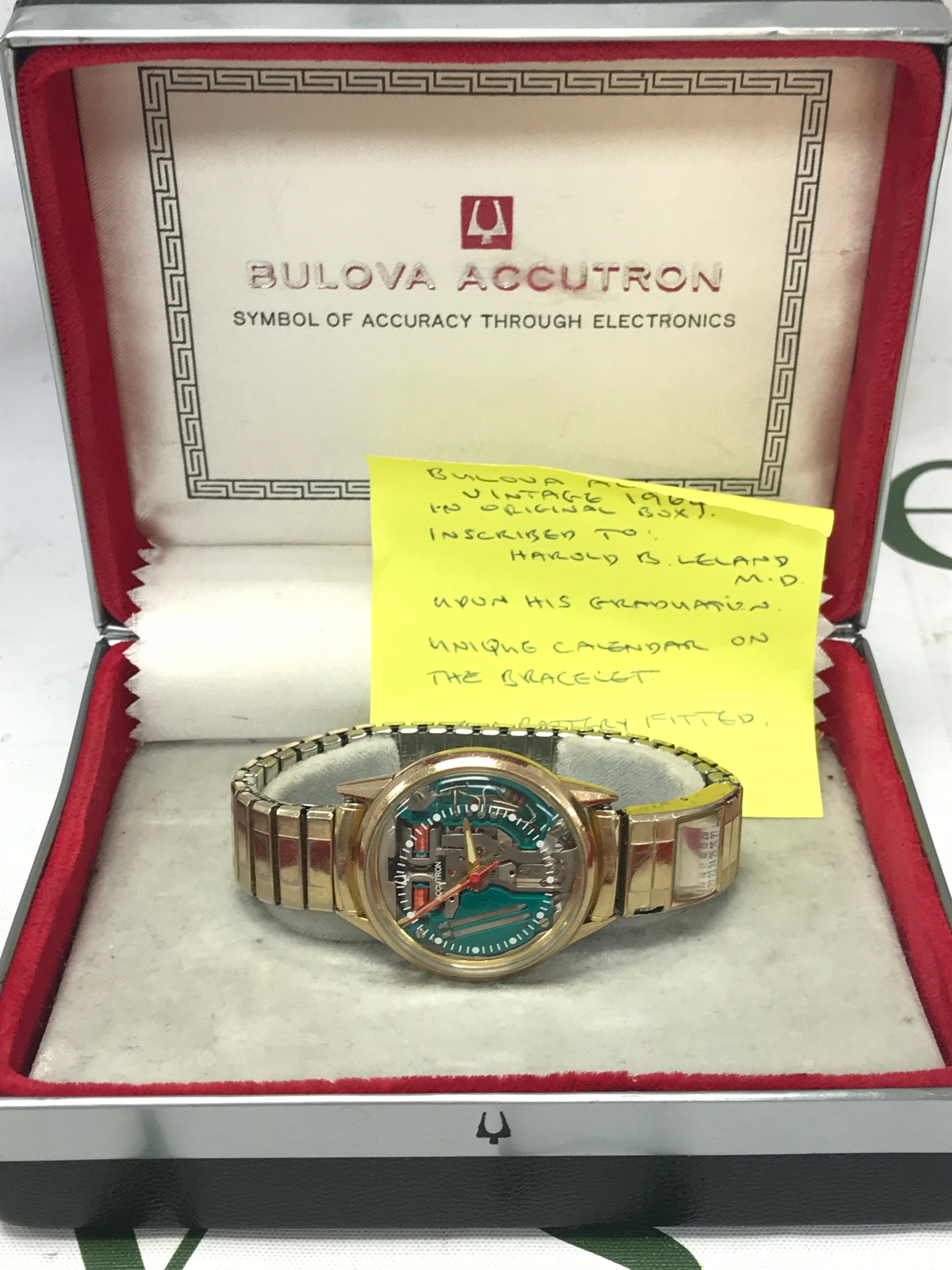 A Bulova Accutron vintage 1964 in original box. Unique calendar on bracelet. Seen working 