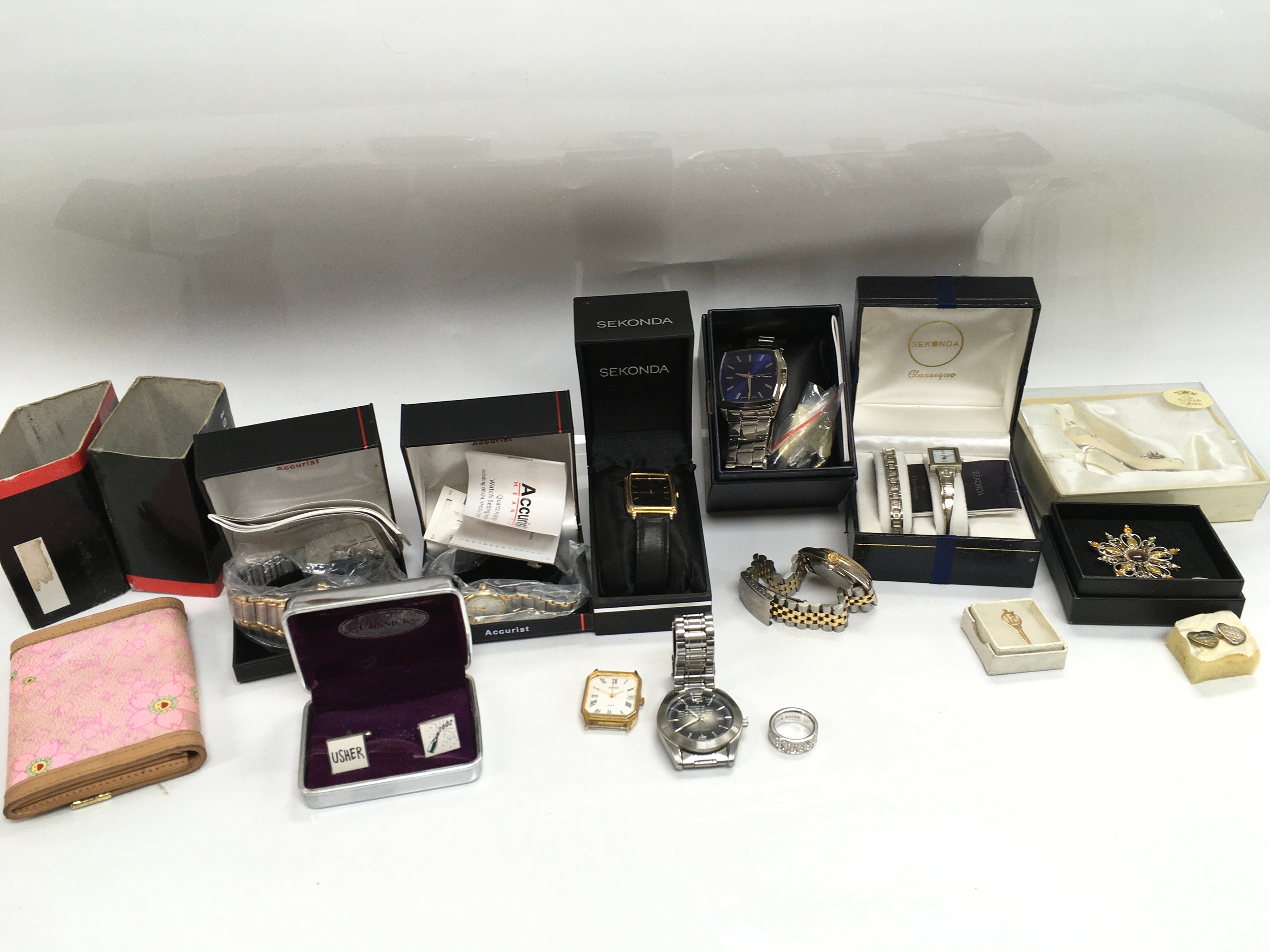 A collection of assorted watches and other items including cuff links etc.