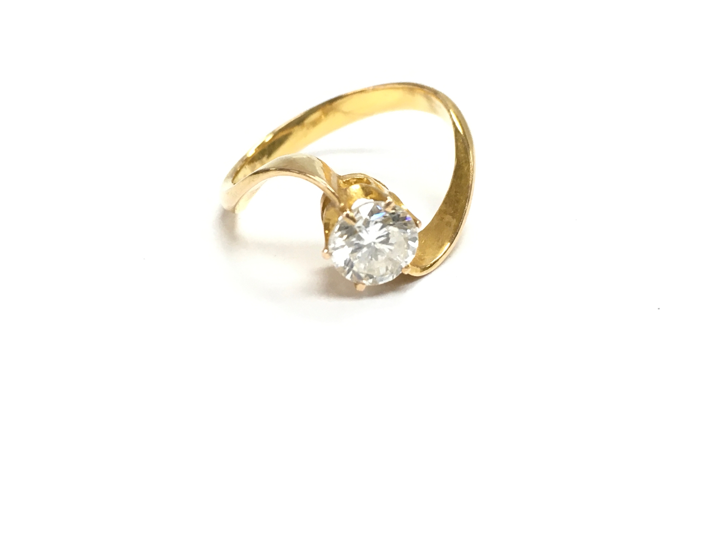 An unmarked gold diamond solitaire ring. 
approx J 1/2 and 0.40ct 