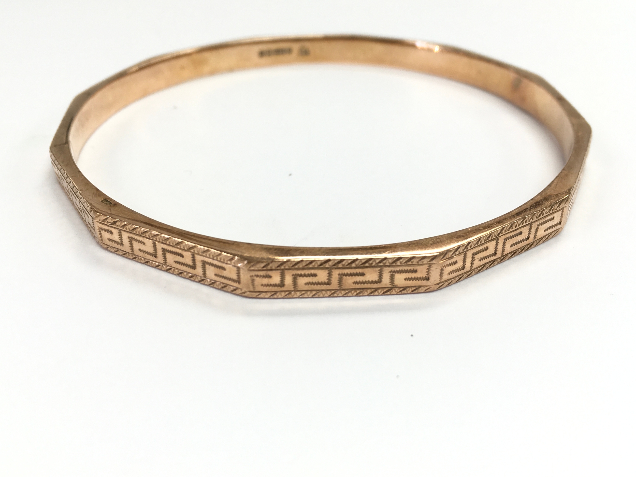 A 9ct gold bangle. 81mm diameter and 12.23g