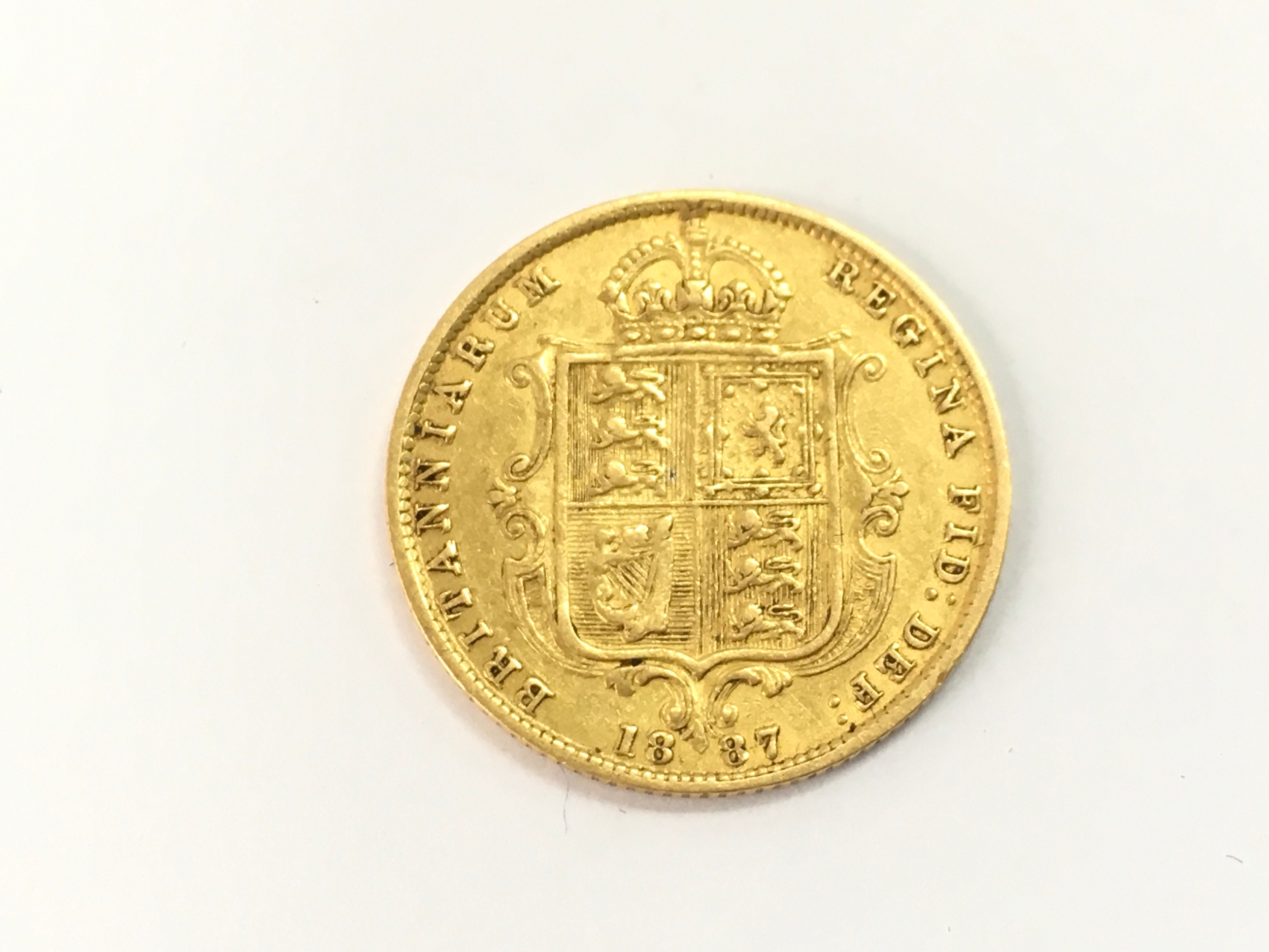 An 1887 half shield back sovereign 