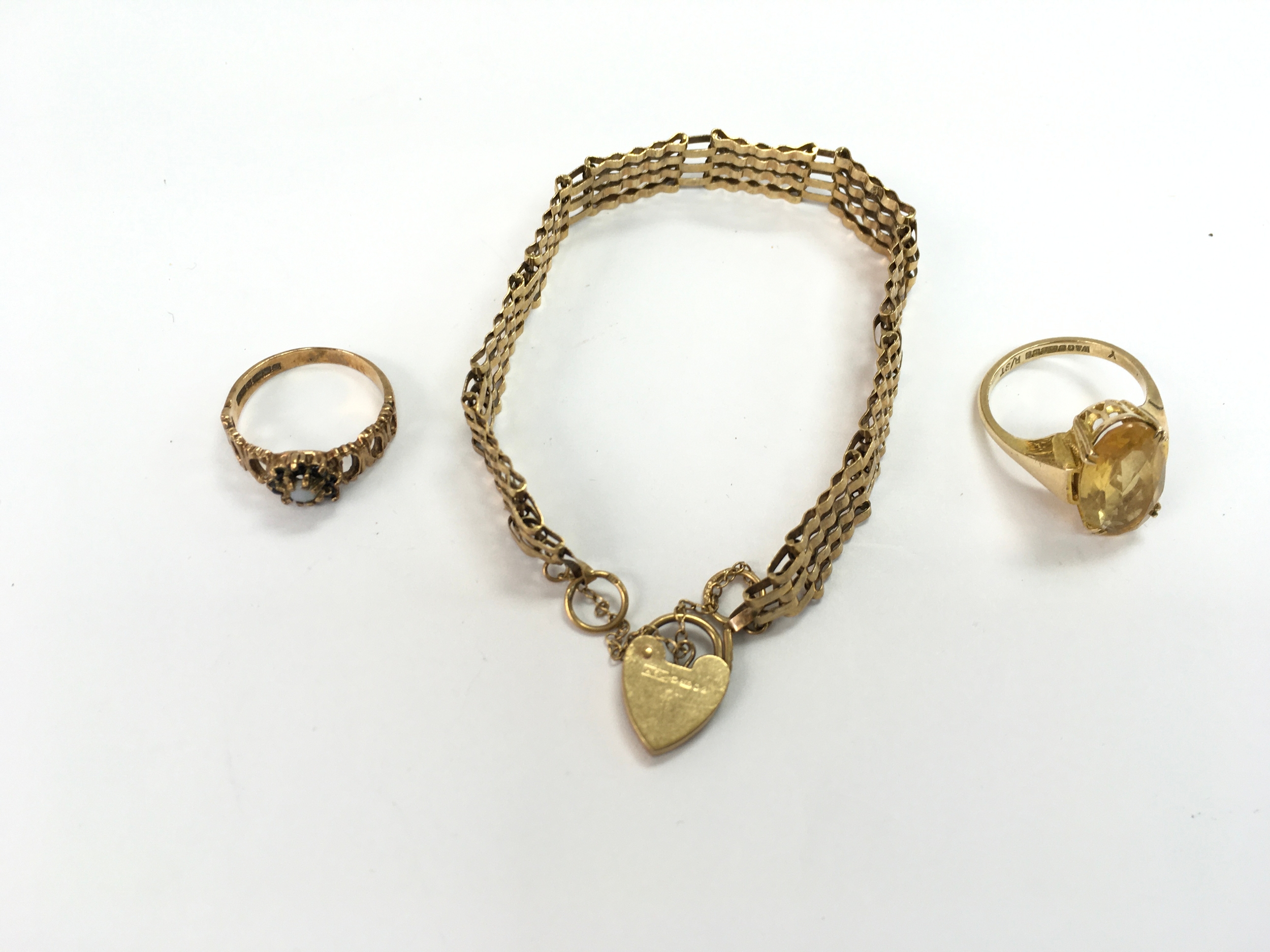 Two 9ct gold rings and a 9ct gold bracelet. 14g total 