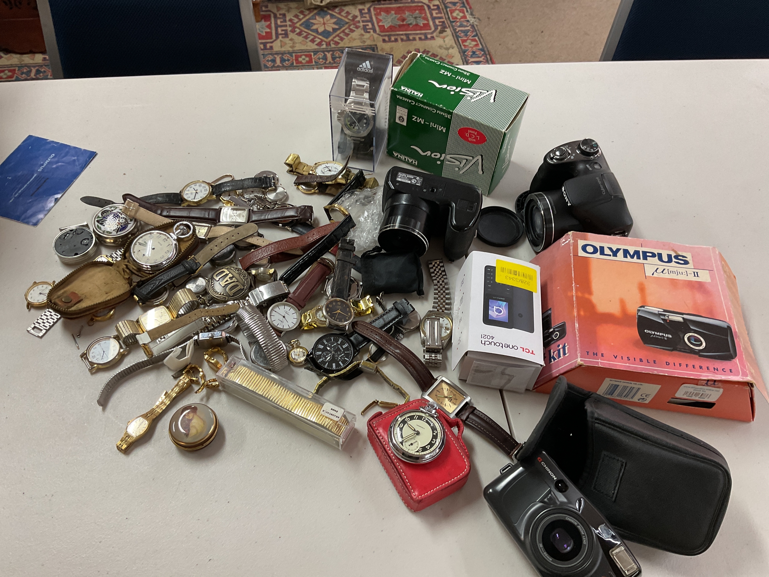 Qty vintage watches and cameras.