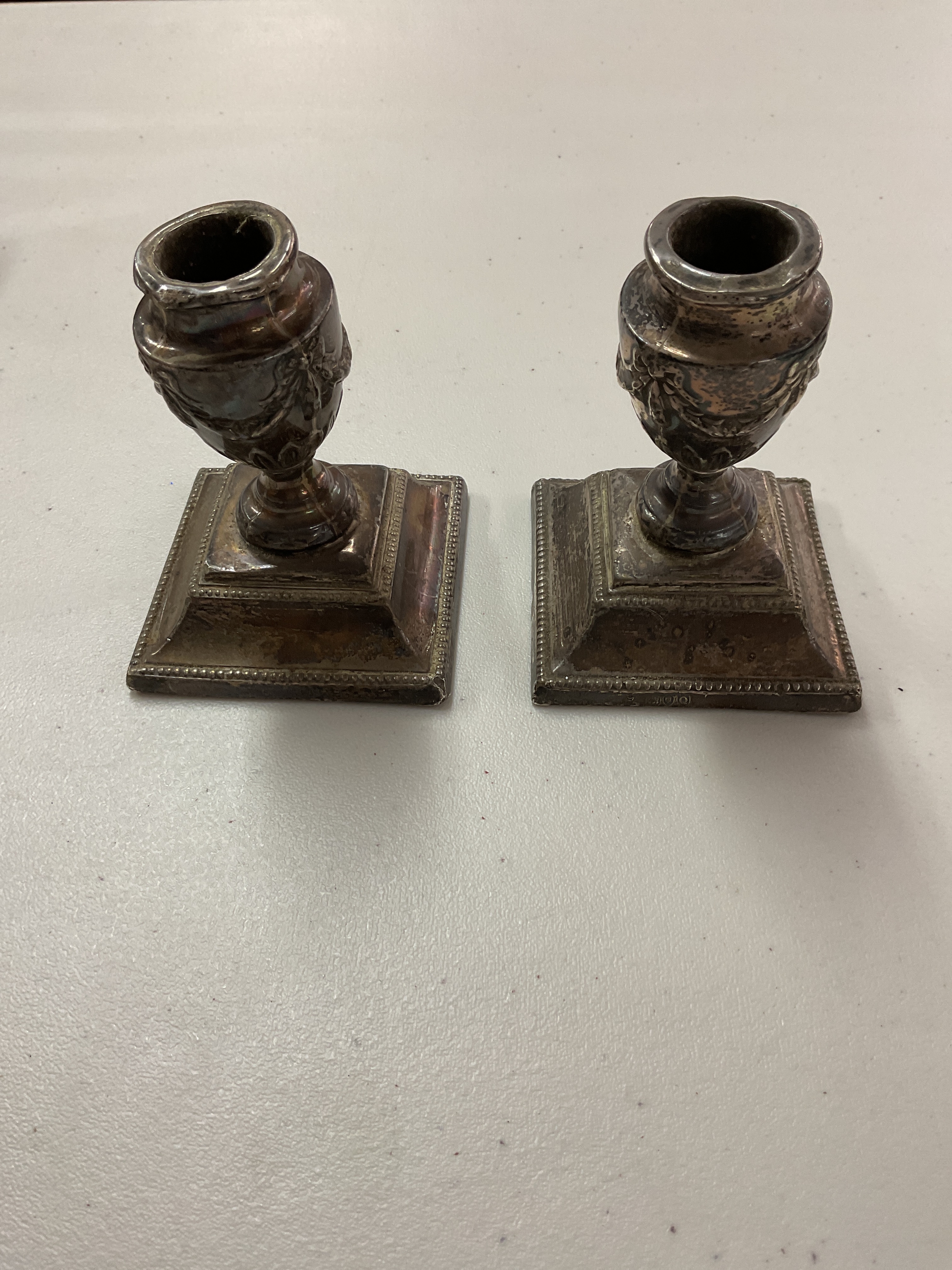 Pair Silver Victorian squat candlesticks with weighted bases.