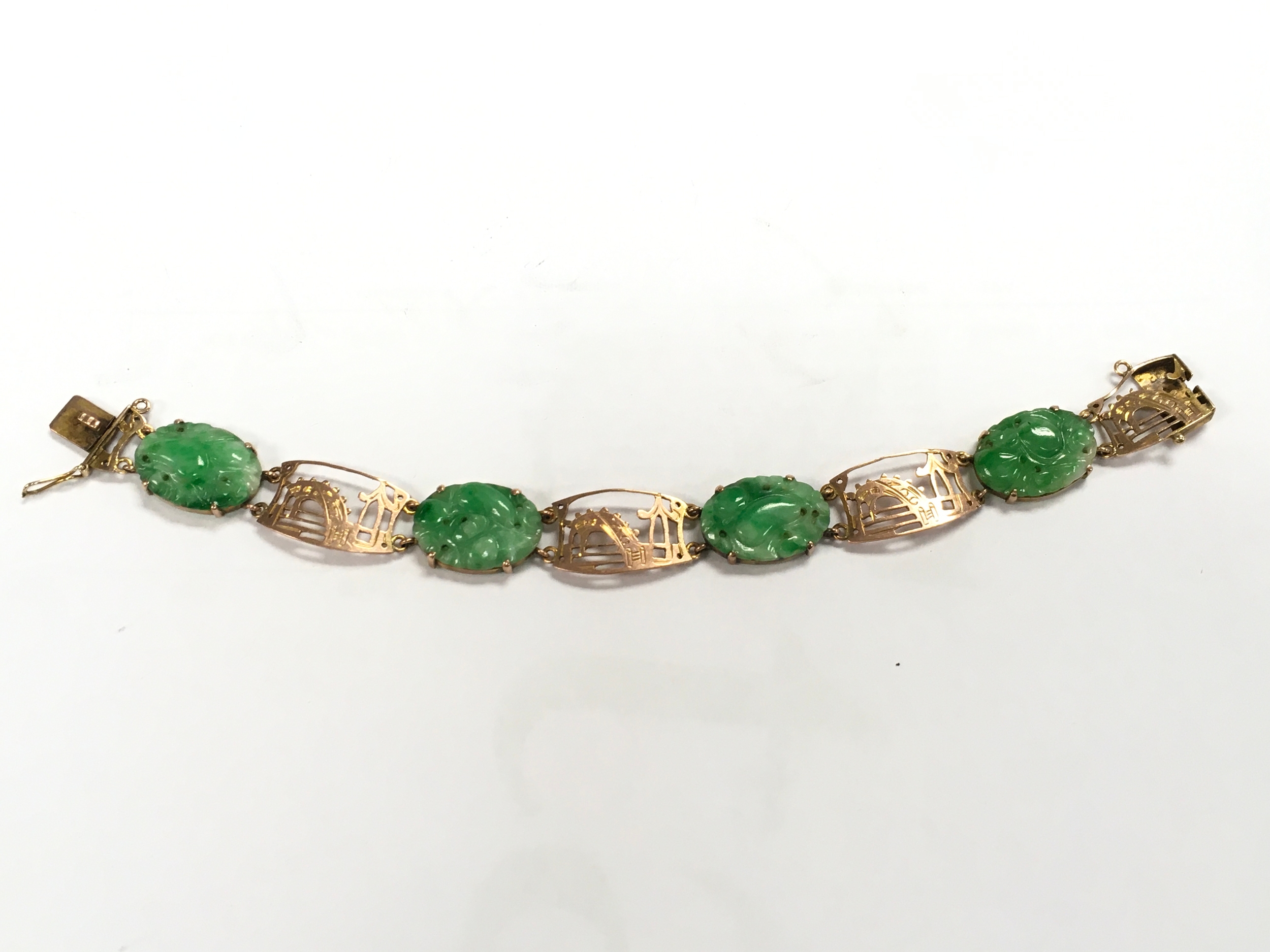 A 9ct Gold jade bracelet, 11.5g total weight. 17cm long