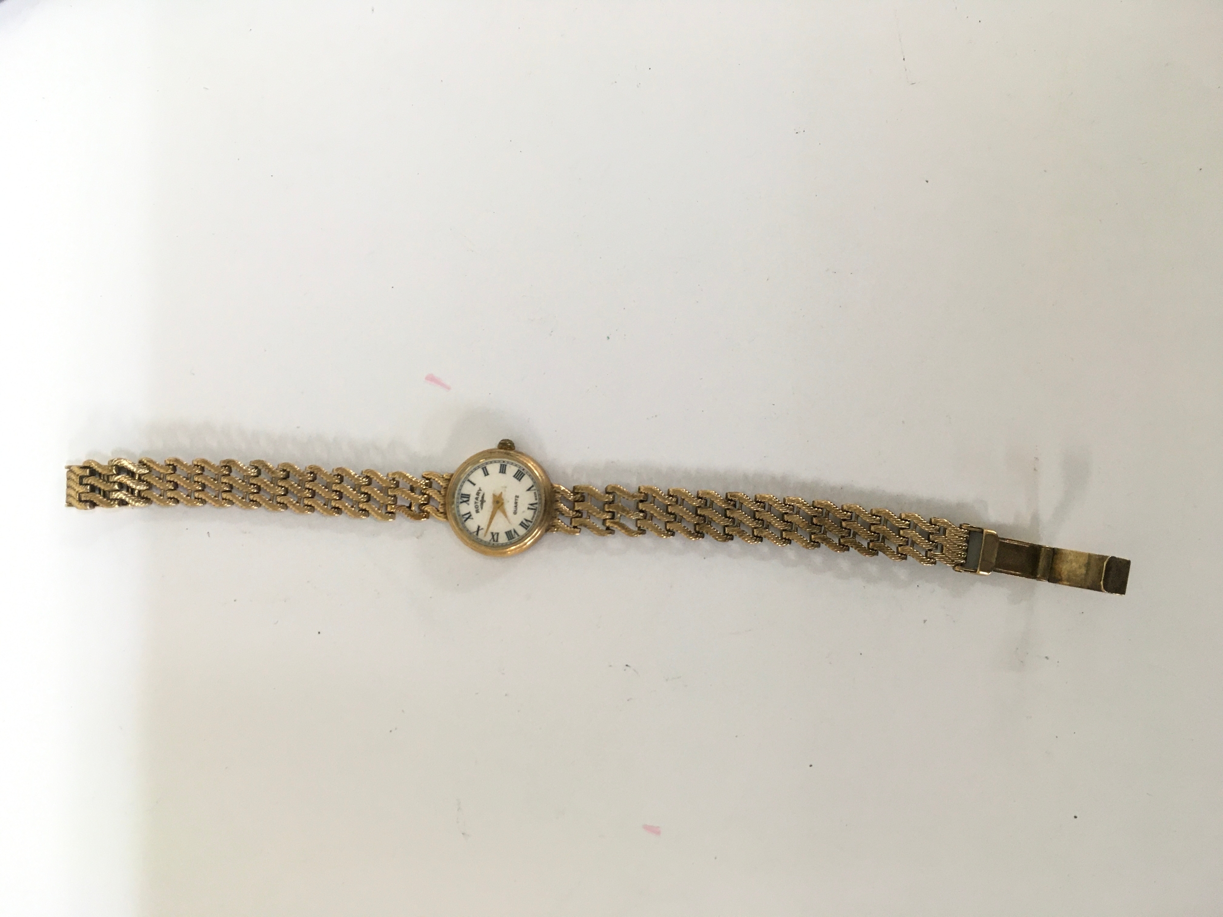 A 9ct gold Rotary lady's vintage wristwatch on woven strap. Approx: W1.5 x L18cm. 11.7g total weight