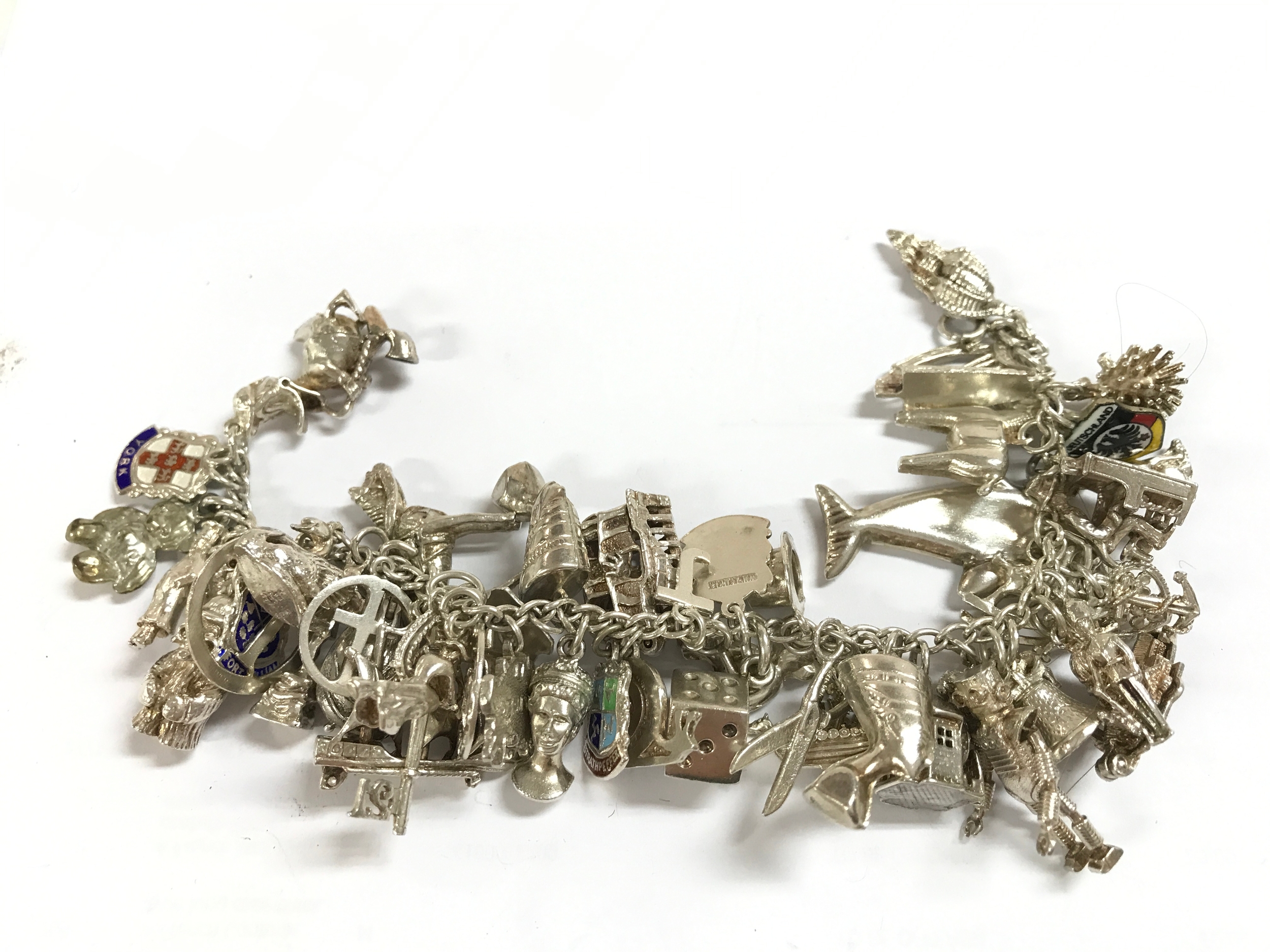 A heavy silver charm bracelet 117g total weight