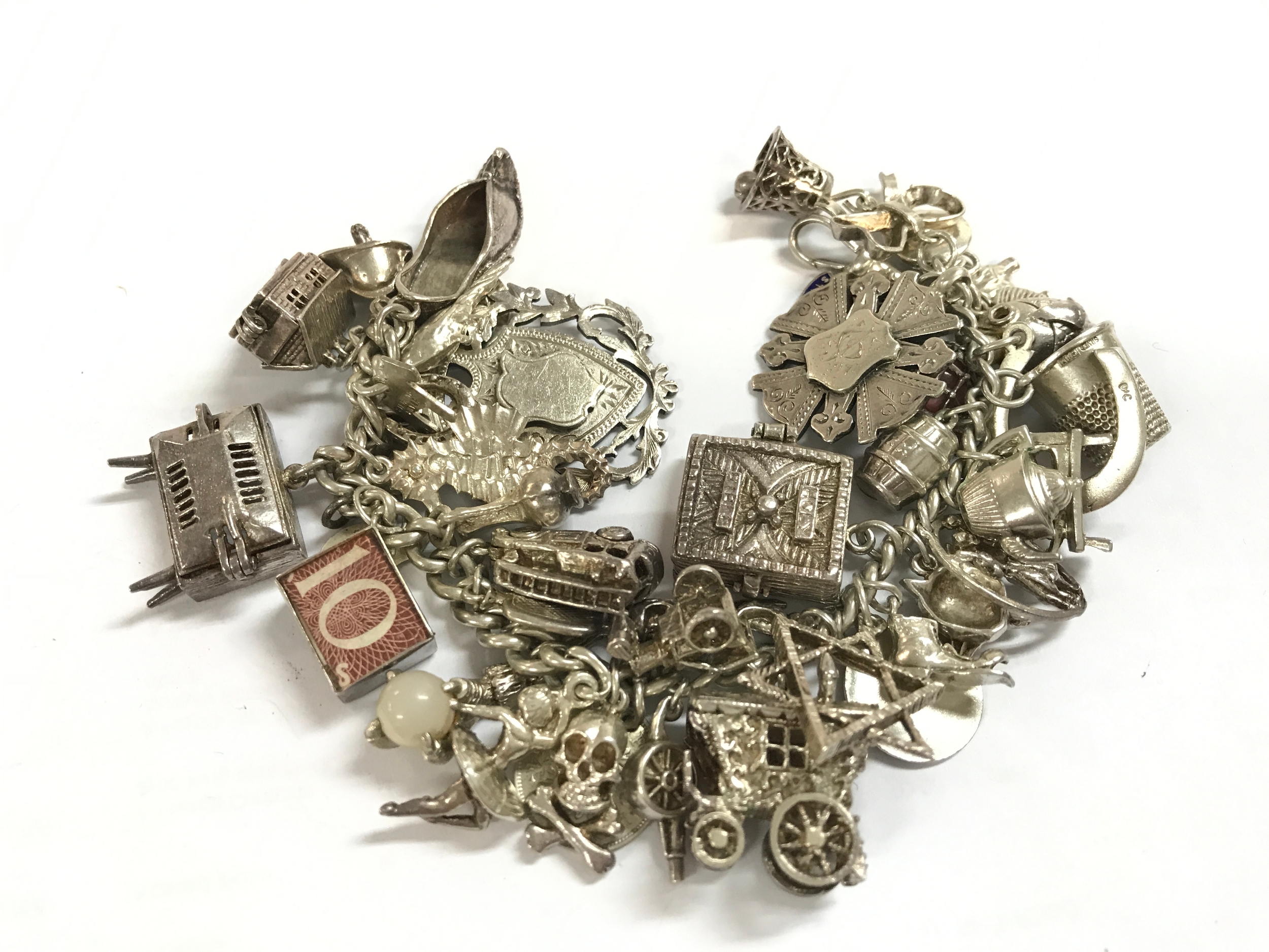 A heavy silver charm bracelet 134g total weight