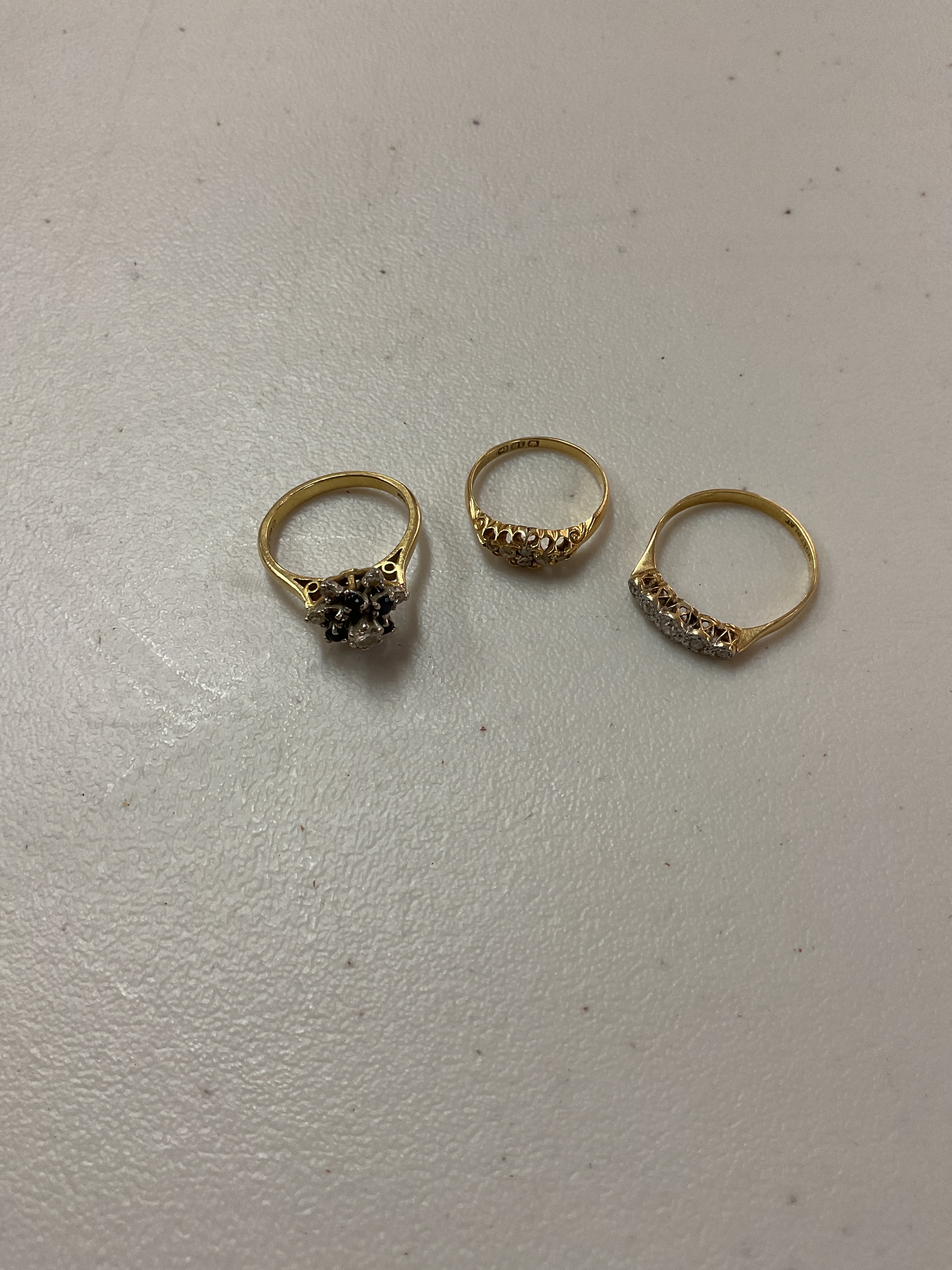 Three 18 ct Diamond rings. Weight 9 grams.