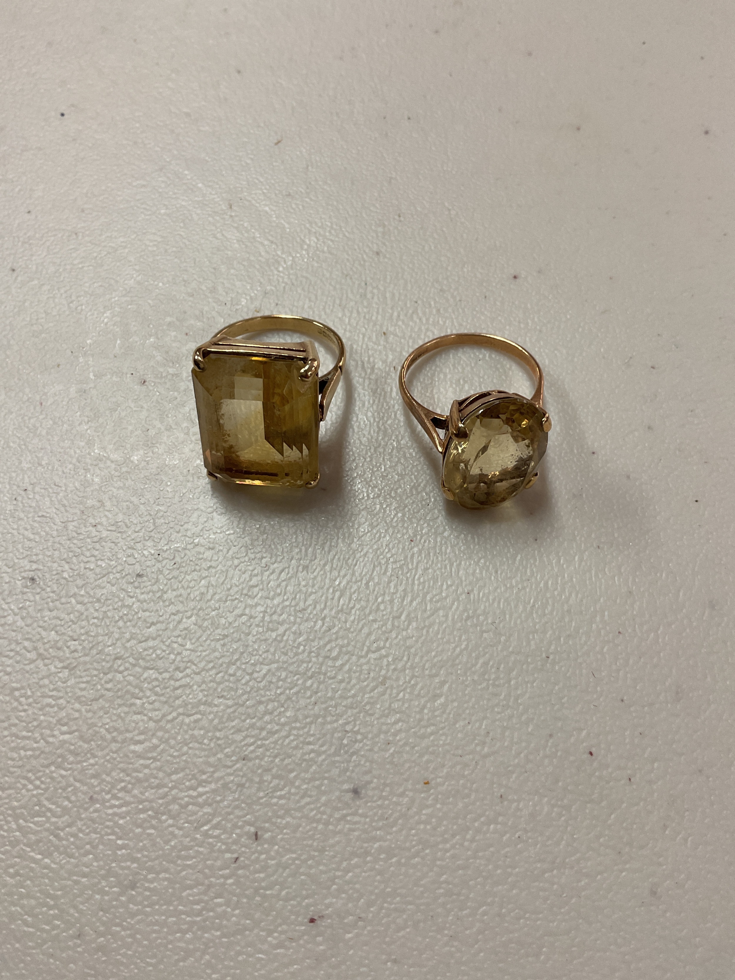 Two large 9ct stone set rings, oval and emerald cut examples.