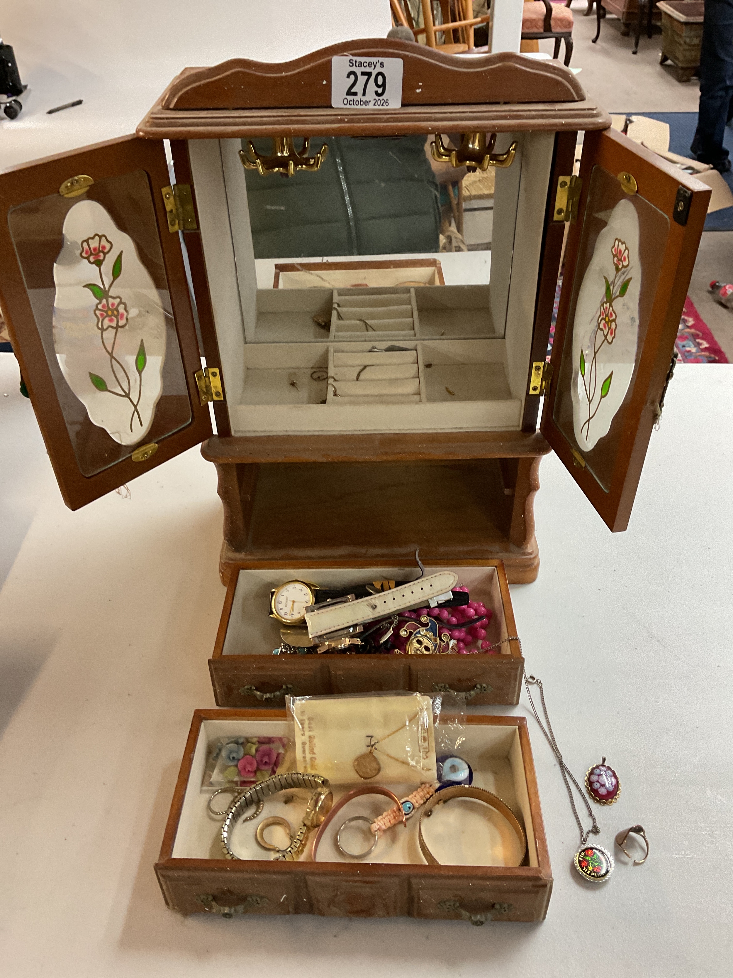 Jewellery cabinet with dress jewellery and 9 ct gold coin ring .
