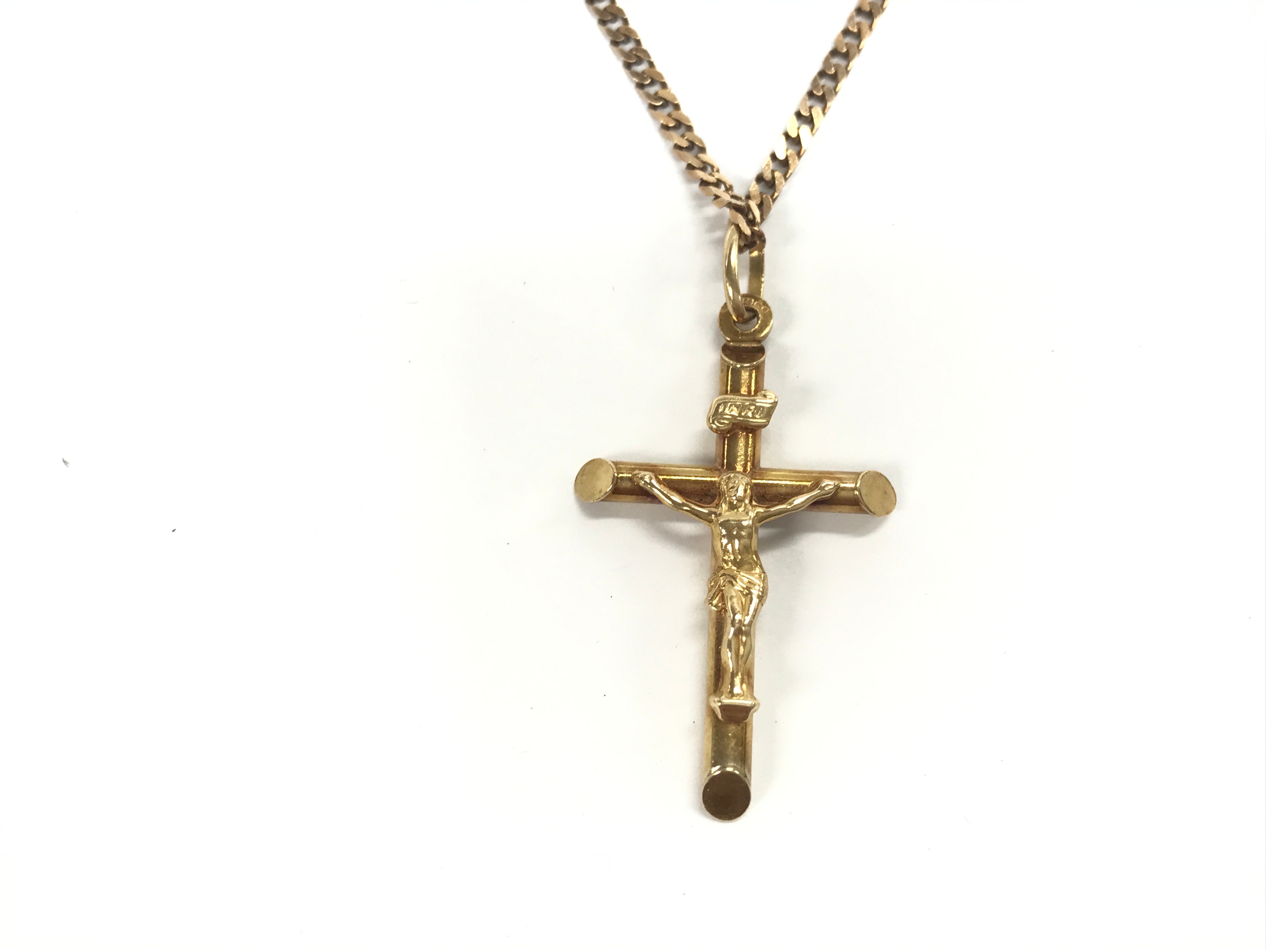 A 9ct gold cross pendant on a 9ct chain. 6.7g