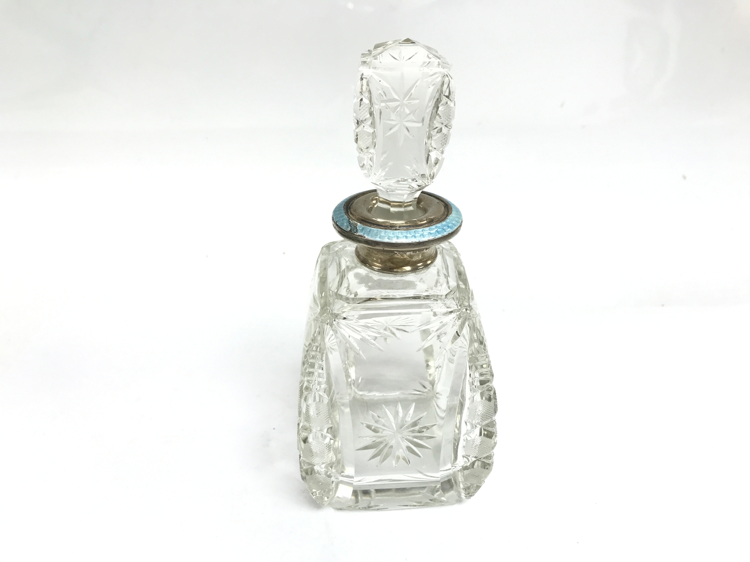 antique square cut glass perfume bottle with silver collar and with light blue enamel
