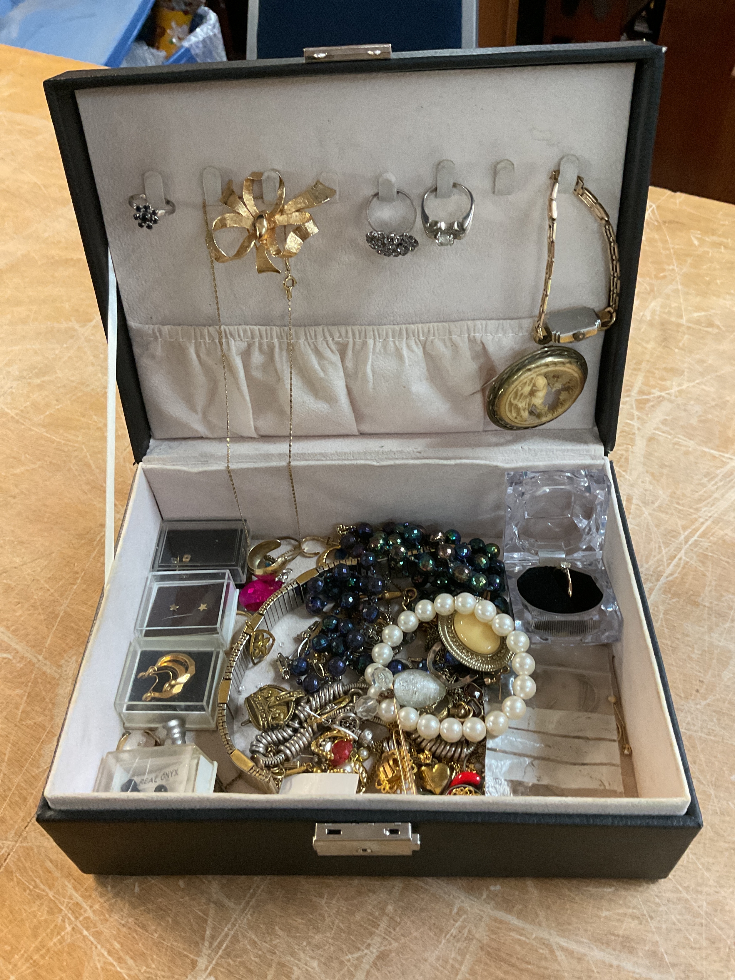 Jewellery box of dress jewellery and gold tooth.